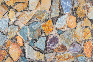 Color stone in the cement wall for background texture.