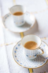 Cups of coffee on the table vertical