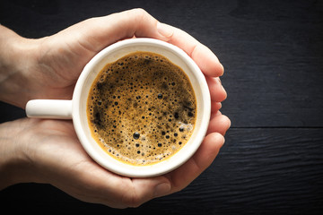 Cup of coffee in the hands horizontal
