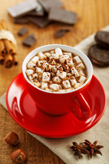 Mug of hot chocolate on table. Traditional holiday cocoa drink for breakfast.