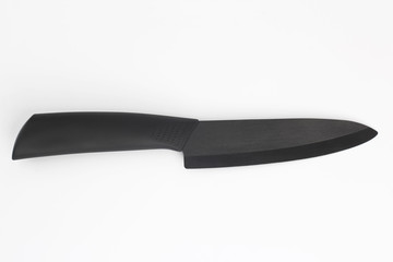 kitchen knife with black ceramic blade on a white background