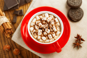 Mug of hot chocolate with marshmallow. Cocoa with cookies. Top view.