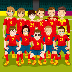 Full soccer team posing on soccer field ready to play