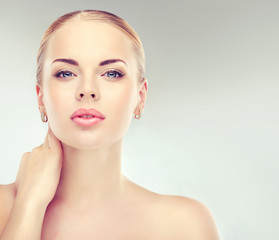 Beautiful Young Woman with Clean Fresh Skin close up . Skin care face . Cosmetology