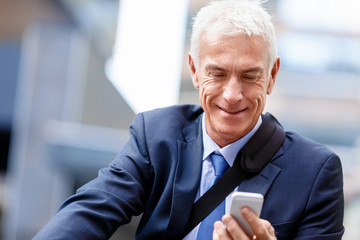 Successful businessman riding bicycle