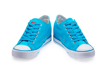 A pair of blue gumshoes with shoelace