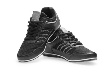 A pair of black sports shoes with shoelace