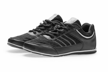 A pair of black sports shoes with laces