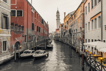 Fototapeta na wymiar Venetian canal among old houses in Venice, Italy