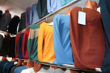 Men sweater (jacket) on a shelf in the store