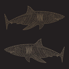 Beige shark from squares, circles and flowers on a black background.