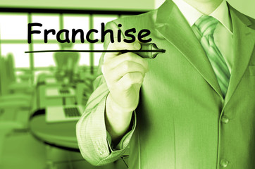 business man writing franchise