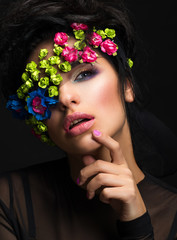 Naklejka premium Fashion portrait of a beautiful girl with bandage over one eye