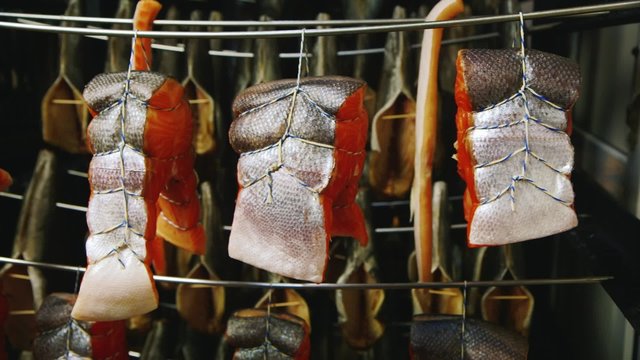 Steaks of red fish on the seafood stock