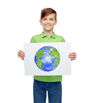 happy boy holding drawing or picture of earth
