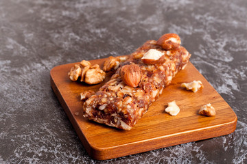 Healthy granola bar on wooden background