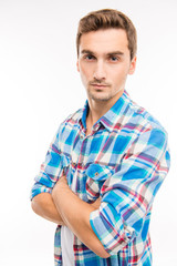 Obraz premium Confident cute handsome man crossing hands