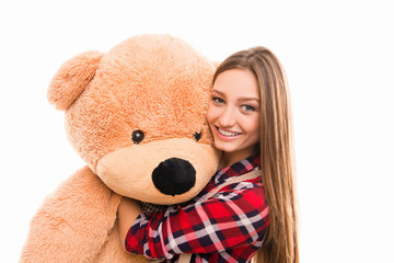 Portrait of smiling happy woman with cute teddy bear