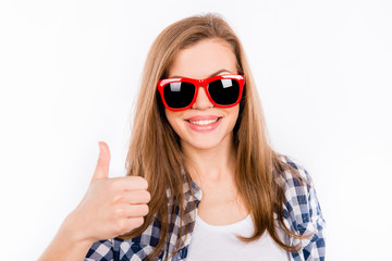 Funny girl in glasses with a red rim showing thumbs up