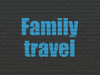 Fototapeta na wymiar Vacation concept: Family Travel on wall background