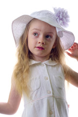 Young blonde little girl with white hat