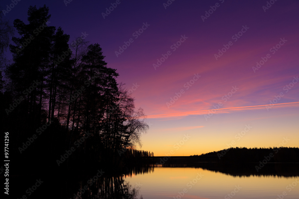 Wall mural serene view of calm lake at twilight