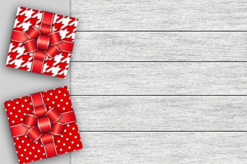 Obraz premium christmas presents lying on wooden desk