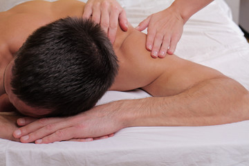 Fototapeta na wymiar Man having massage. Relaxation, body care treatment, spa, wellness concept
