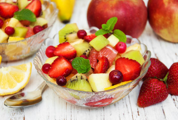 Fototapeta na wymiar Salad with fresh fruits