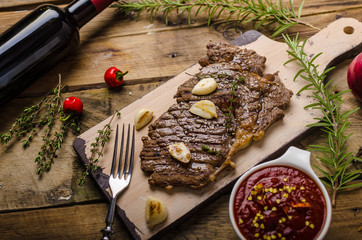 Rib eye steak with wine
