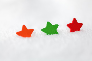 christmas background with copy space. Three stars on snow