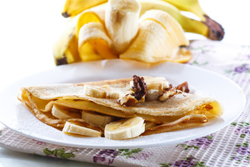 sweet pancakes with bananas and nuts 