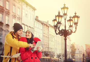 Happy tourists in morning city background