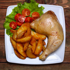 Fried chicken legs with french fries on the table