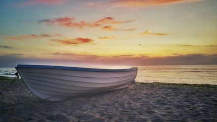 Beautiful sunrise and fishing boat