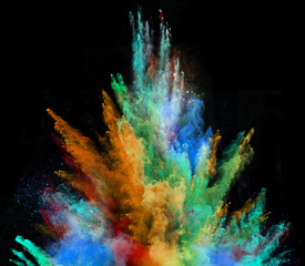 Launched colorful powder on black background