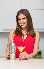 Beautiful woman making a cocktail