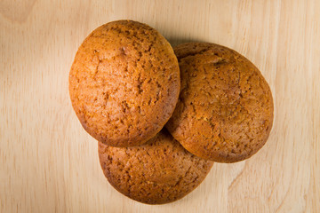 Oatmeal cookies on a wooden surface.