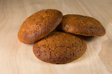 Oatmeal cookies on a wooden surface.