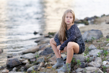 portrait of little girl outdoors in summer
