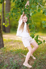 portrait of little girl outdoors in summer