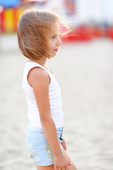 portrait of little girl outdoors in summer