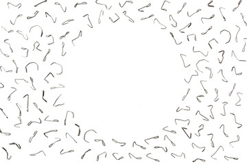 Bent staples to fasten papers. The background for your office