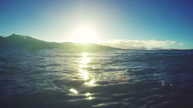 Extreme Kitesurfing at Sunset. Summer Ocean Sport in Slow Motion. Girl Kite Surfing in Bikini 