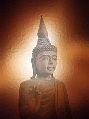 Buddha image over brown light sunset abstract background