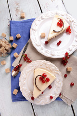 Tasty cheesecake with berries on table close up