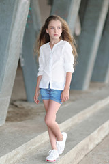 portrait of little girl outdoors in summer