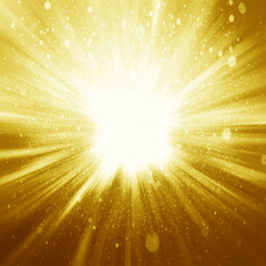 Golden sparkling background with intense glowing sparkles and gl