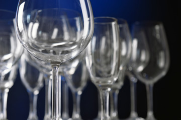 Empty wine glasses on blue background