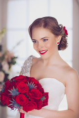Portrait of Young Beautiful Attractive Bride with Flowers. White Dress and Wedding Decorations. Vintage Toning